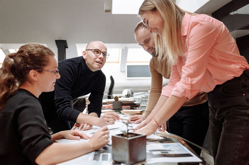 How can we use human and organizational psychology to boost both performance and employee satisfaction