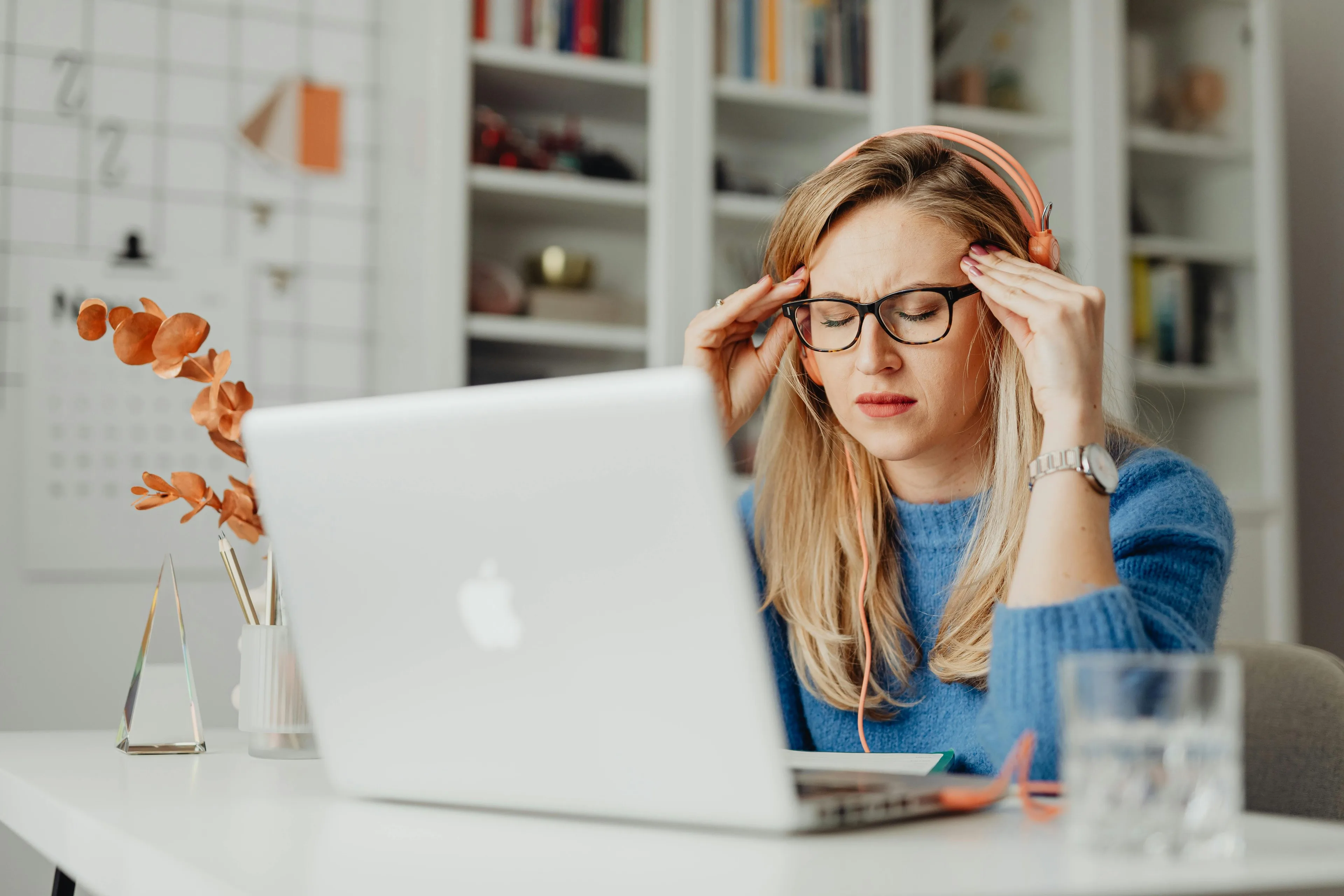 A woman stressed using a laptop