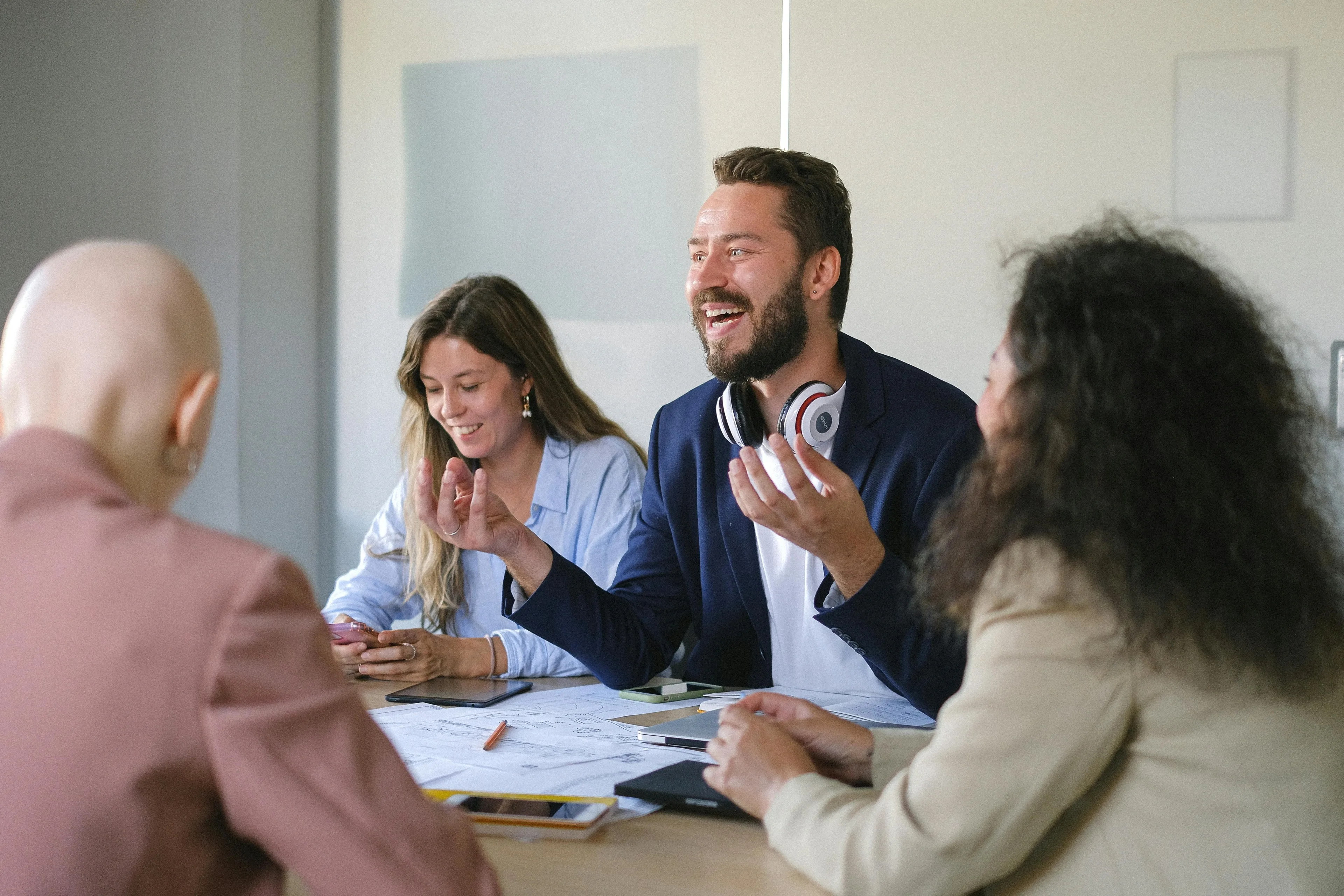 Coworkers in a workplace meeting with happy people