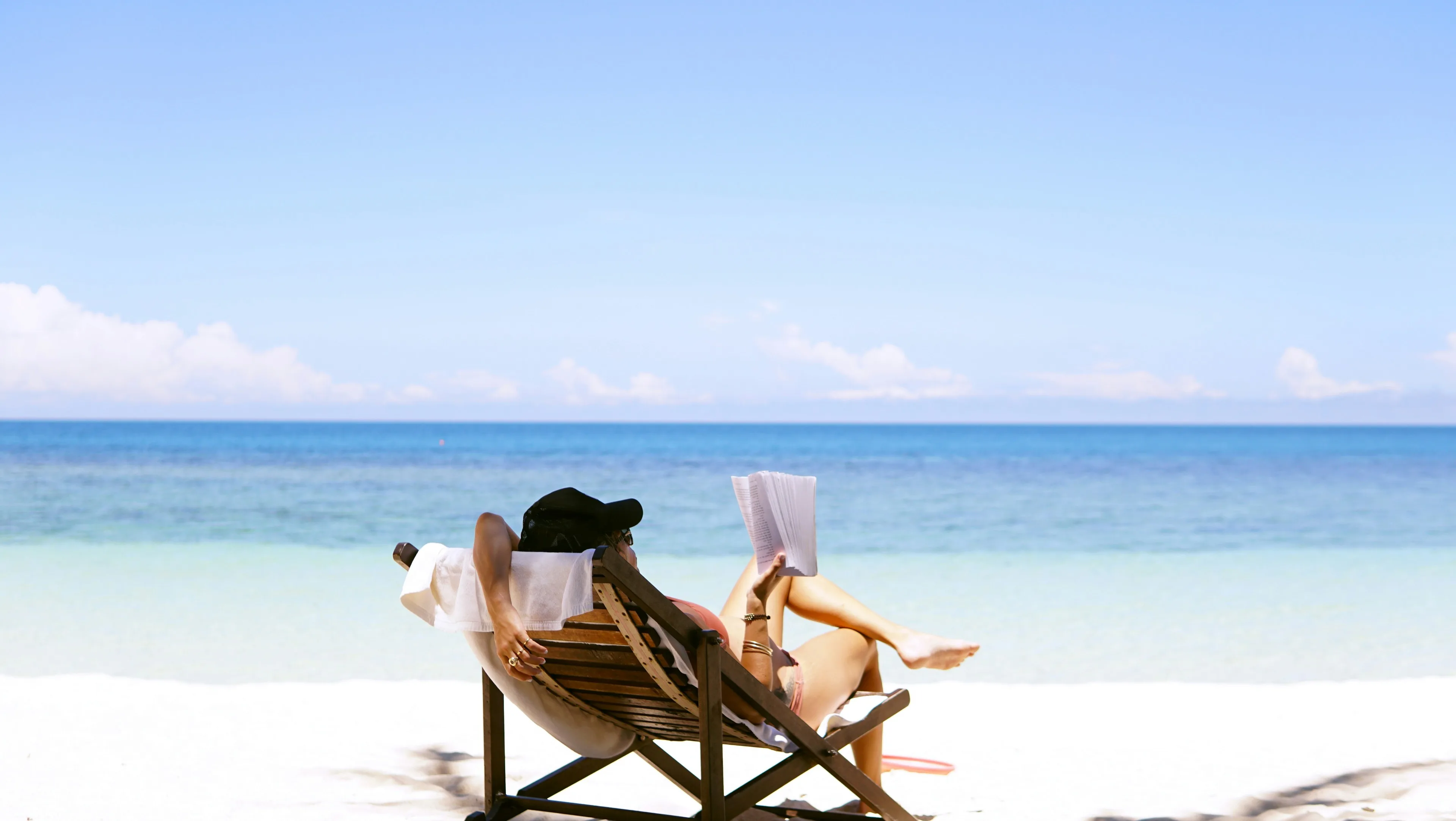 Reading a book in a sunny beach