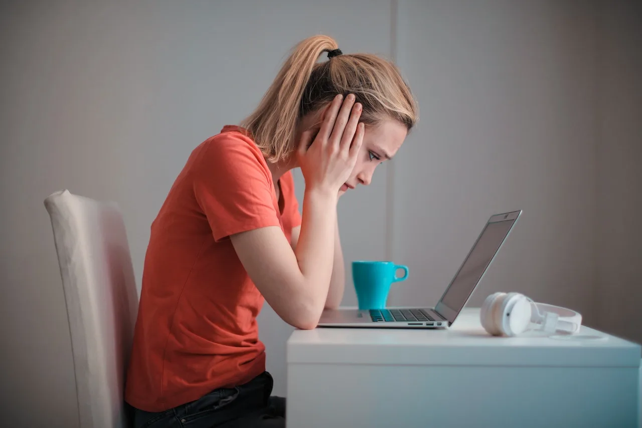 Stressed woman using a laptop